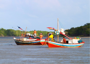 These colorful fishing boats, typical of the region, are powered by one-cylinder engines similar to those that served as workhorses of small boats 50 years ago in the United States. Some rely on sail power alone.