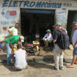 Omar Sousa (far right) and Carolina Linder (seated, middle) help us with the mechanic that finally fixed our generator. Between the two we have been able to overcome the cultural and linguistic barriers that normally plague a field expedition.