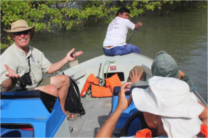 The author wonders what else could go wrong, while Joabe paddles his boat after running out of gas. 