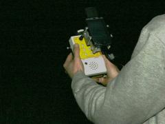 AnaBat acoustic detector. The attached PDA (like a little computer screen) lets us view incoming bat calls instantly. © MacKenzie Hall