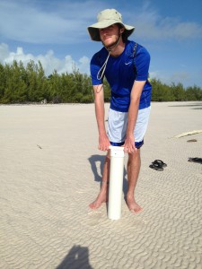 Monmouth University student digging the sediment cores on tidal flat in the Bahamas.