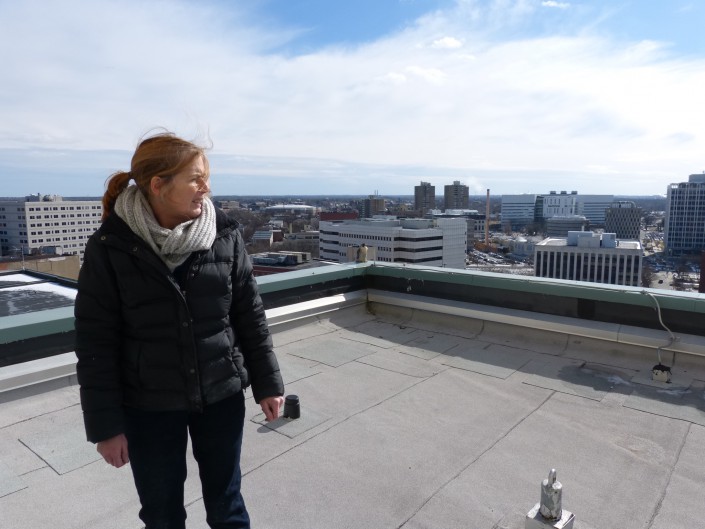 Kathy Clark, ENSP Zoologist determines the best location for the nestbox while the adult female peregrine falcon watches us.  © Jean Bickal