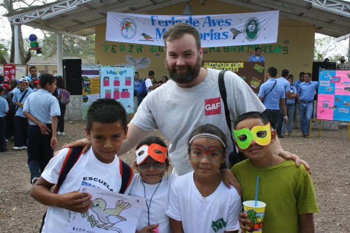 Jon Kauffman, Raptor Center Assistant Director of Penn State’s Shaver's Creek poses with the elementary children at the festival. Photo by Kelly Triece