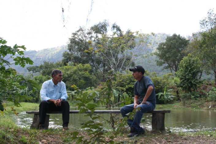 Isidro (on left) and visitor at Isidro's wildlife education preserve.