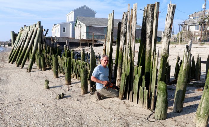 Neil Olafsson saving a crab stucked on a derelict bulkhead